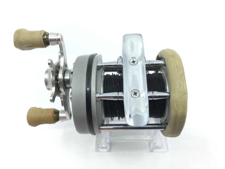 Pflueger Supreme Reel Jumping Fish on Side