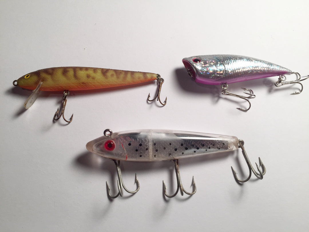 Three Lures for fishing.  L & S, Rebel and YoZuri possible