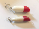 Small Bass Oreno type lures.  Plastic.
