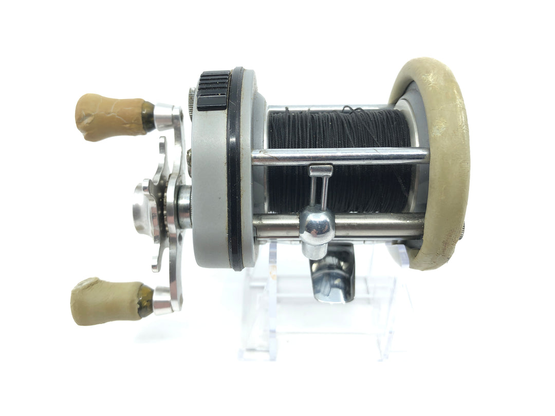 Pflueger Supreme Reel Jumping Fish on Side