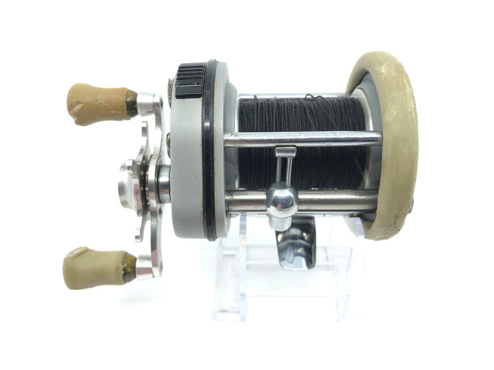 Pflueger Supreme Reel Jumping Fish on Side